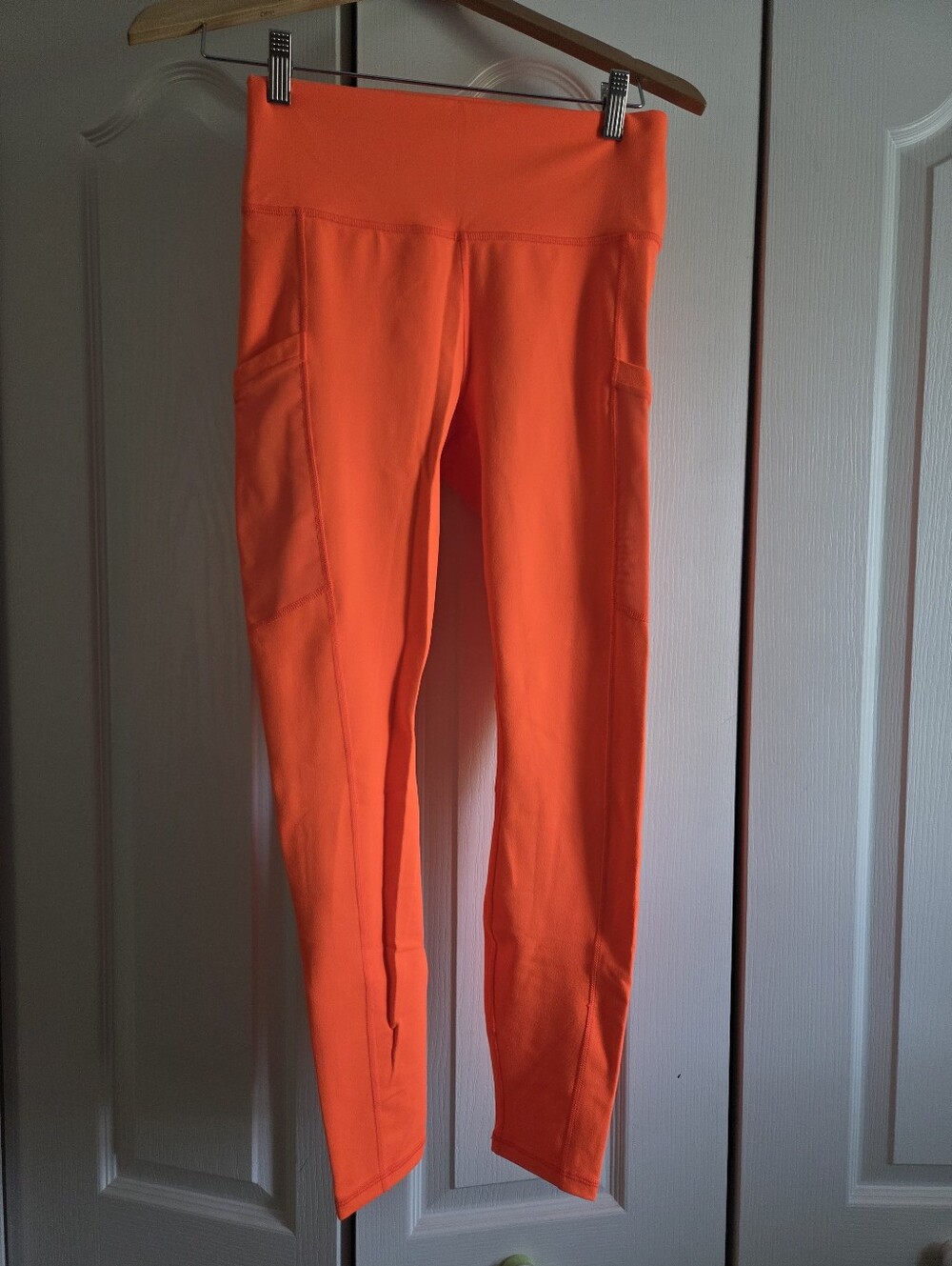 Fabletics Powerhold Neon Orange High-Rise Leggings with Side Pockets